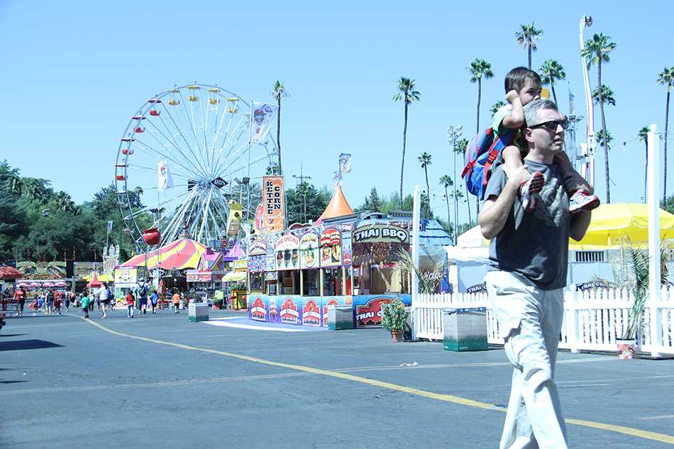A+father+and+son+enjoy+many+different+rides+at+the+annual+LA+County+Fair.+The+fair%2C+which+has+a+lot+of+food%2C+shops%2C+stands%2C+animals%2C+attractions%2C+and+exhibits%2C+began+on+Aug.+30+and+will+end+on+Sept.+29.