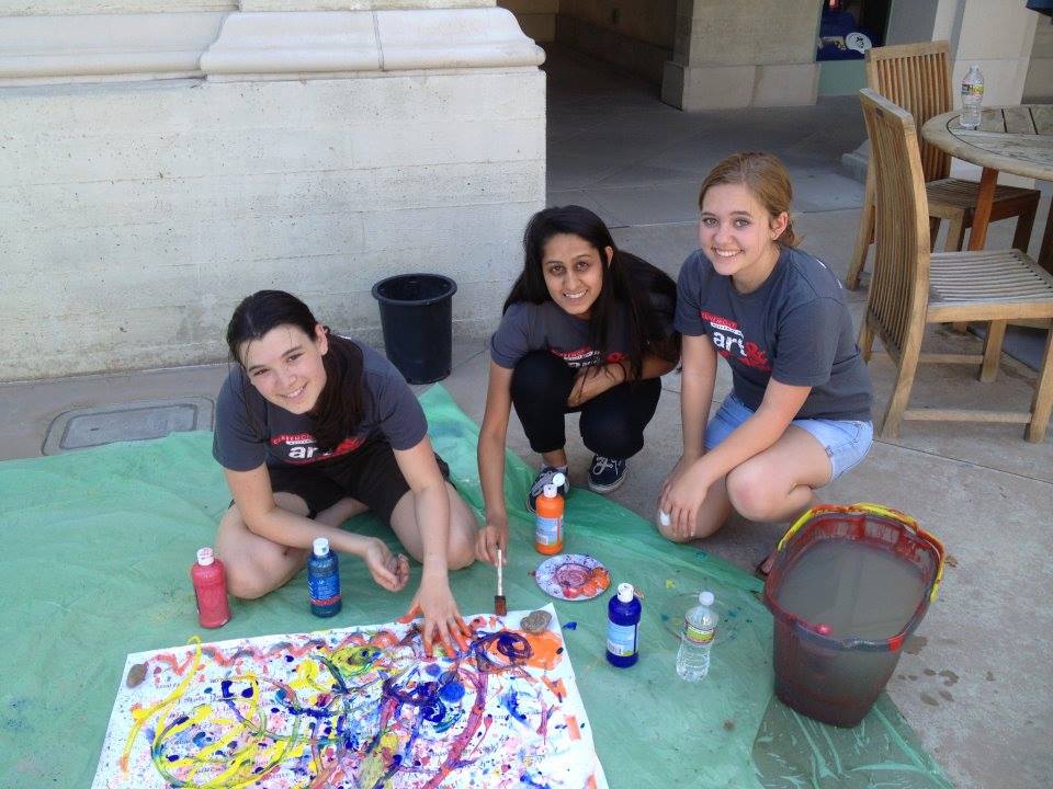 From left to right: Seniors Mimi Kome, Tanzila Suliman, and Madeline Helland share their appreciation of art with young students in Claremont through Project Art Start. 