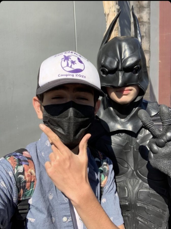 Batman posing with reporter Carson Paul