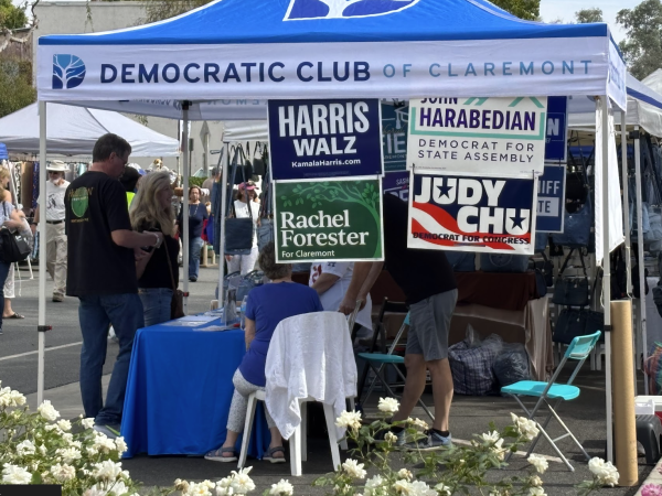 Rachel Forester's campaign sign hangs from the Democratic Club of Claremont's booth at village venture.