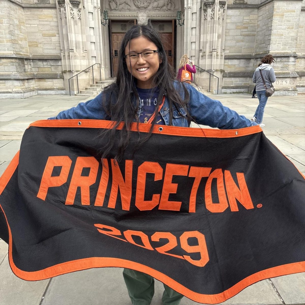 Mayo Ou stands in front of the Princeton  University Chapel on Preview Day.