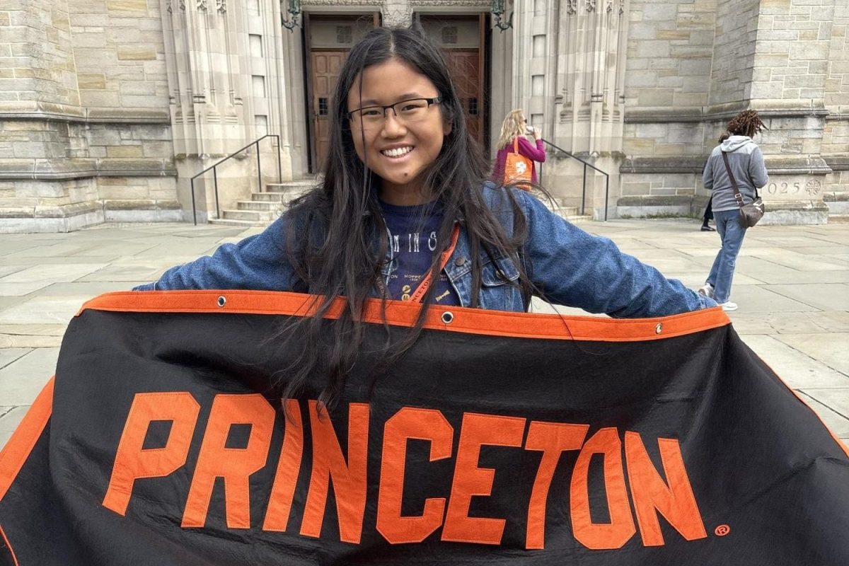 Mayo Ou stands in front of the Princeton  University Chapel on Preview Day.